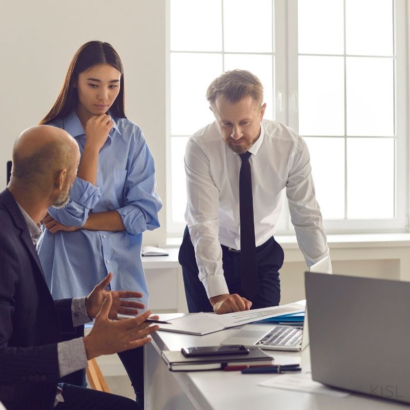A small business team discussing financial records